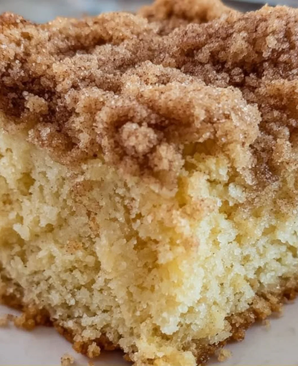 Delicious buttermilk coffee cake served on a rustic wooden table