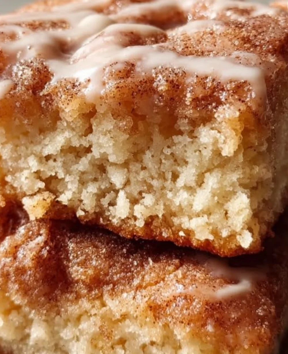 Delicious soft baked maple donut bars with a golden glaze