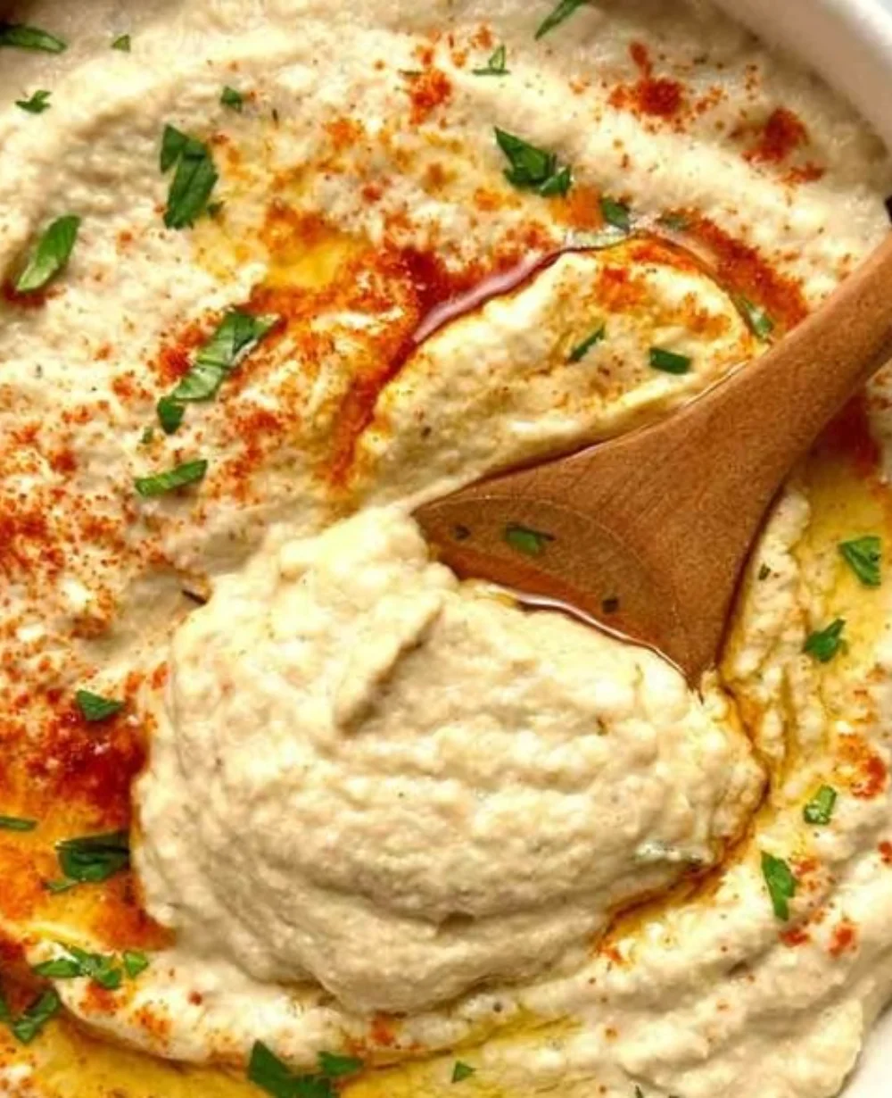 Delicious bowl of Baba Ganoush served with pita bread and vegetables