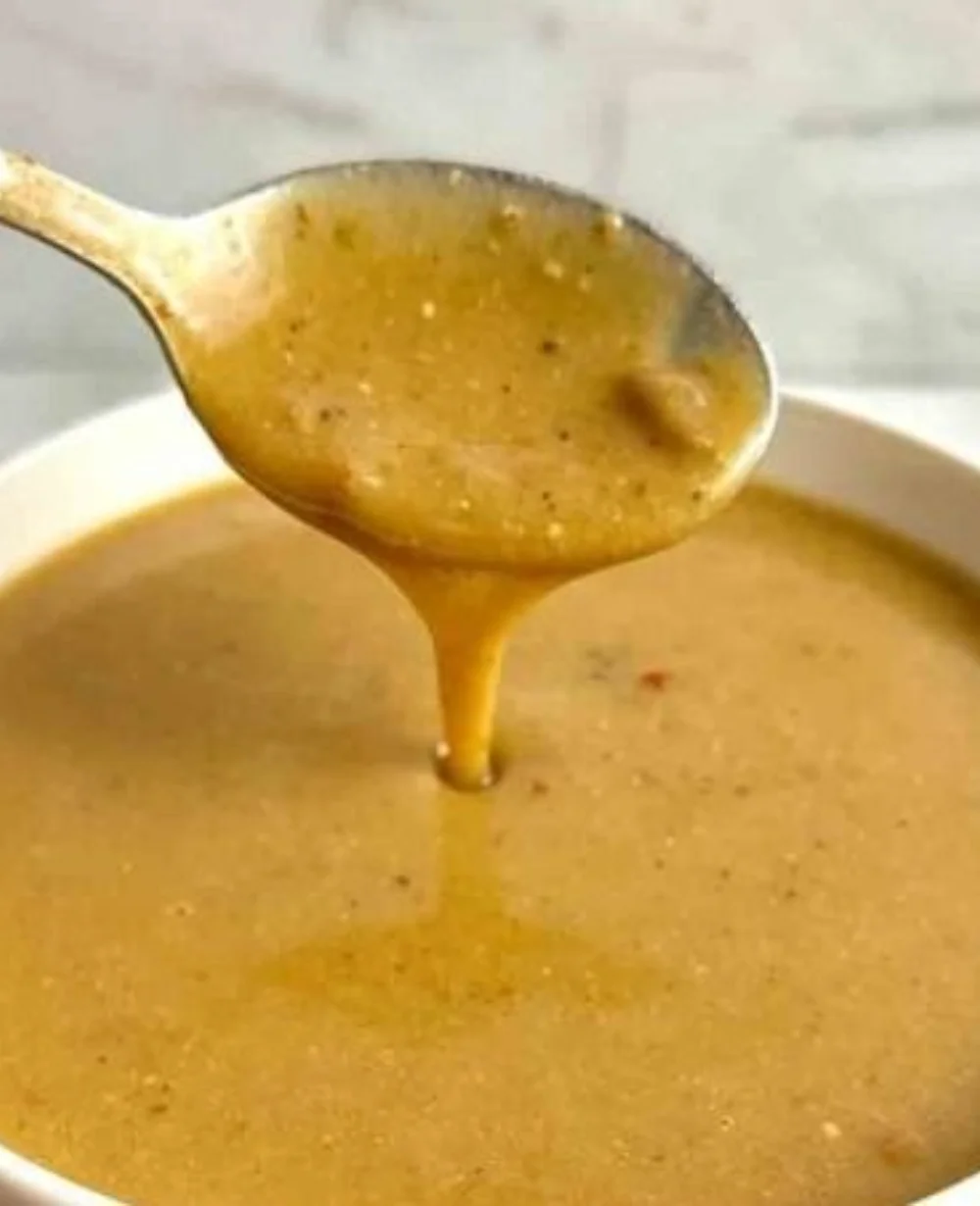 Delicious homemade Cajun gravy inspired by Popeye's recipe in a pan