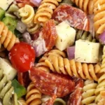 Delicious classic pasta salad with fresh vegetables and dressing