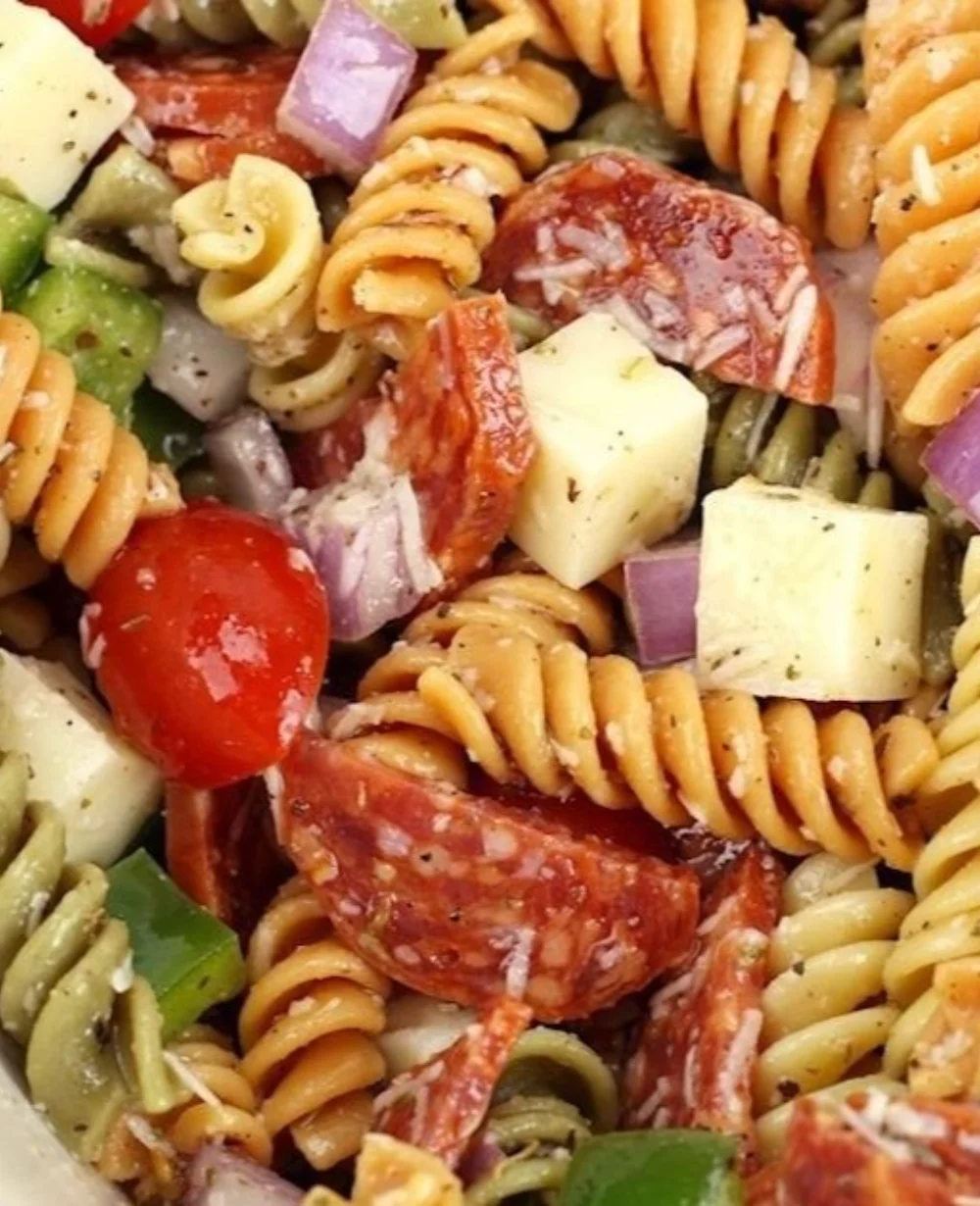Delicious classic pasta salad with fresh vegetables and dressing