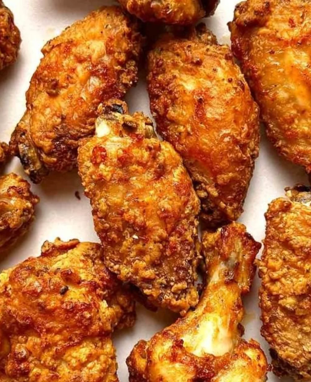 Crispy air fryer chicken wings served with a side of dipping sauce