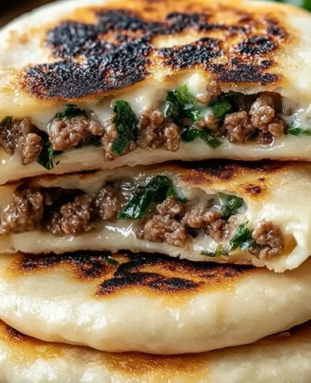 Crispy Lebanese Arayes served with a side of tangy sauce and fresh herbs.