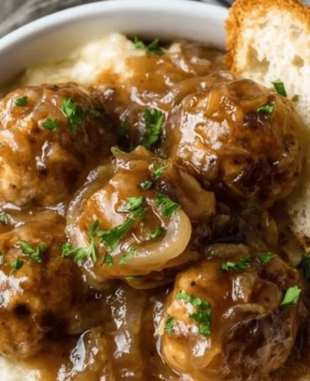 Delicious plated French onion meatballs served with cheese on top