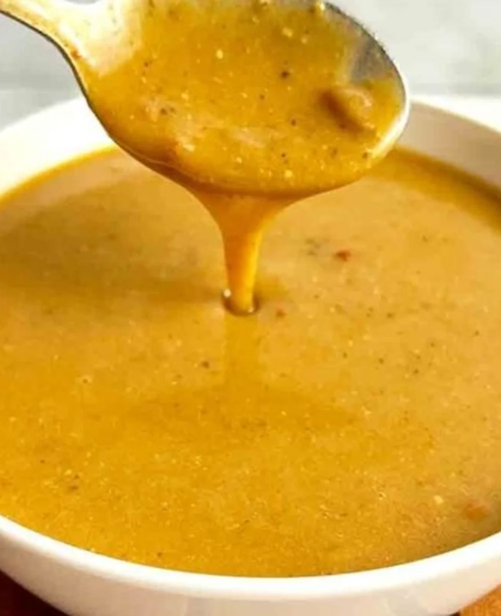 Homemade Cajun gravy inspired by Popeye's recipe, served in a bowl.
