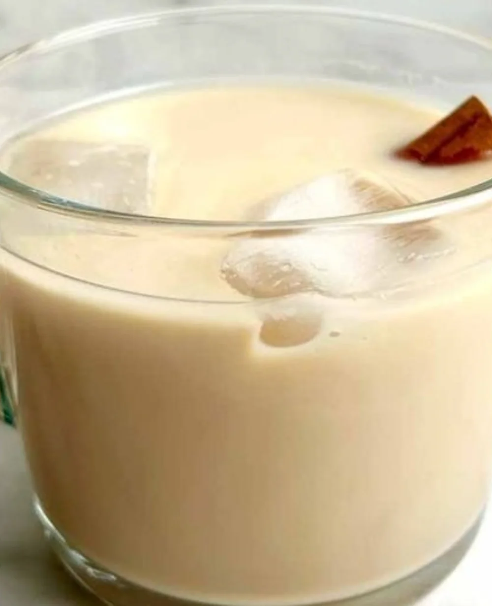 A delicious cup of horchata coffee with cinnamon topping and rice milk.
