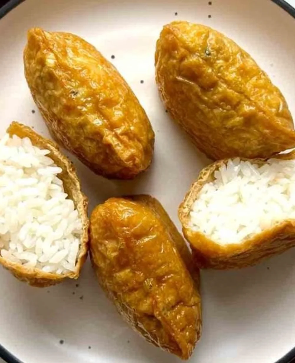 Delicious Inari Sushi with marinated tofu pockets filled with sushi rice.