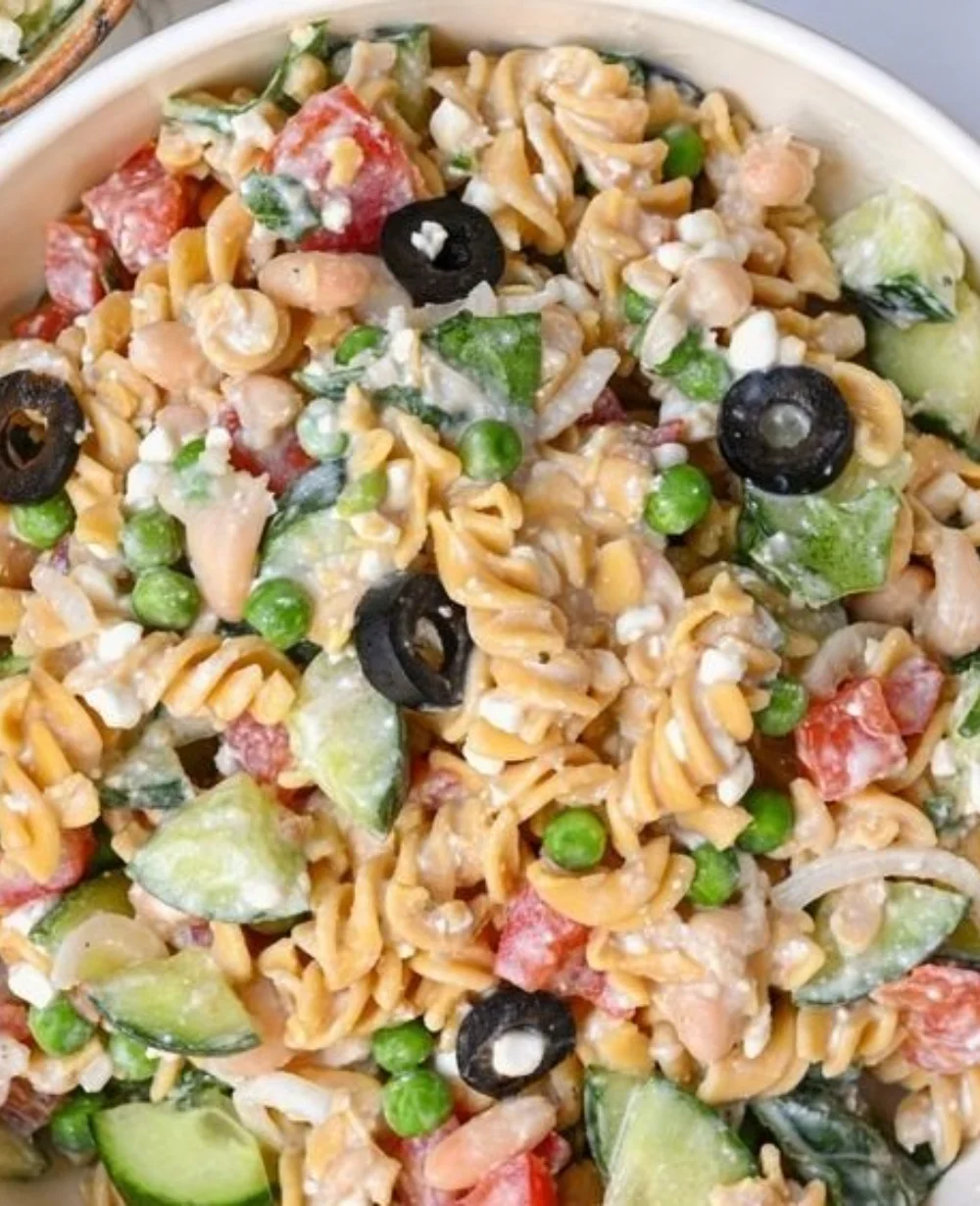 Protein-packed pasta salad served in a colorful bowl, perfect for summer meals.