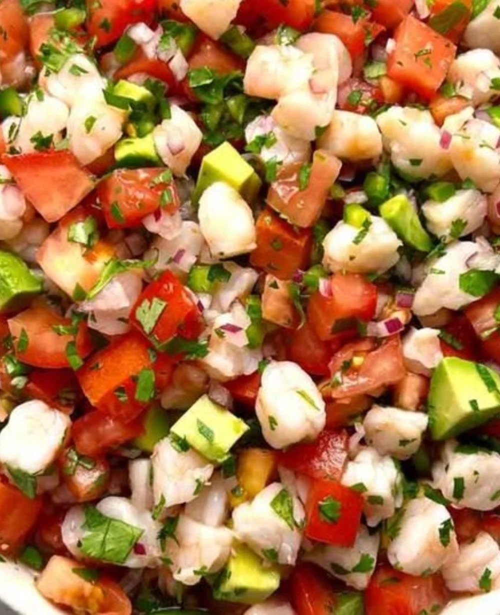 Delicious shrimp ceviche with fresh seafood, lime, and vegetables.