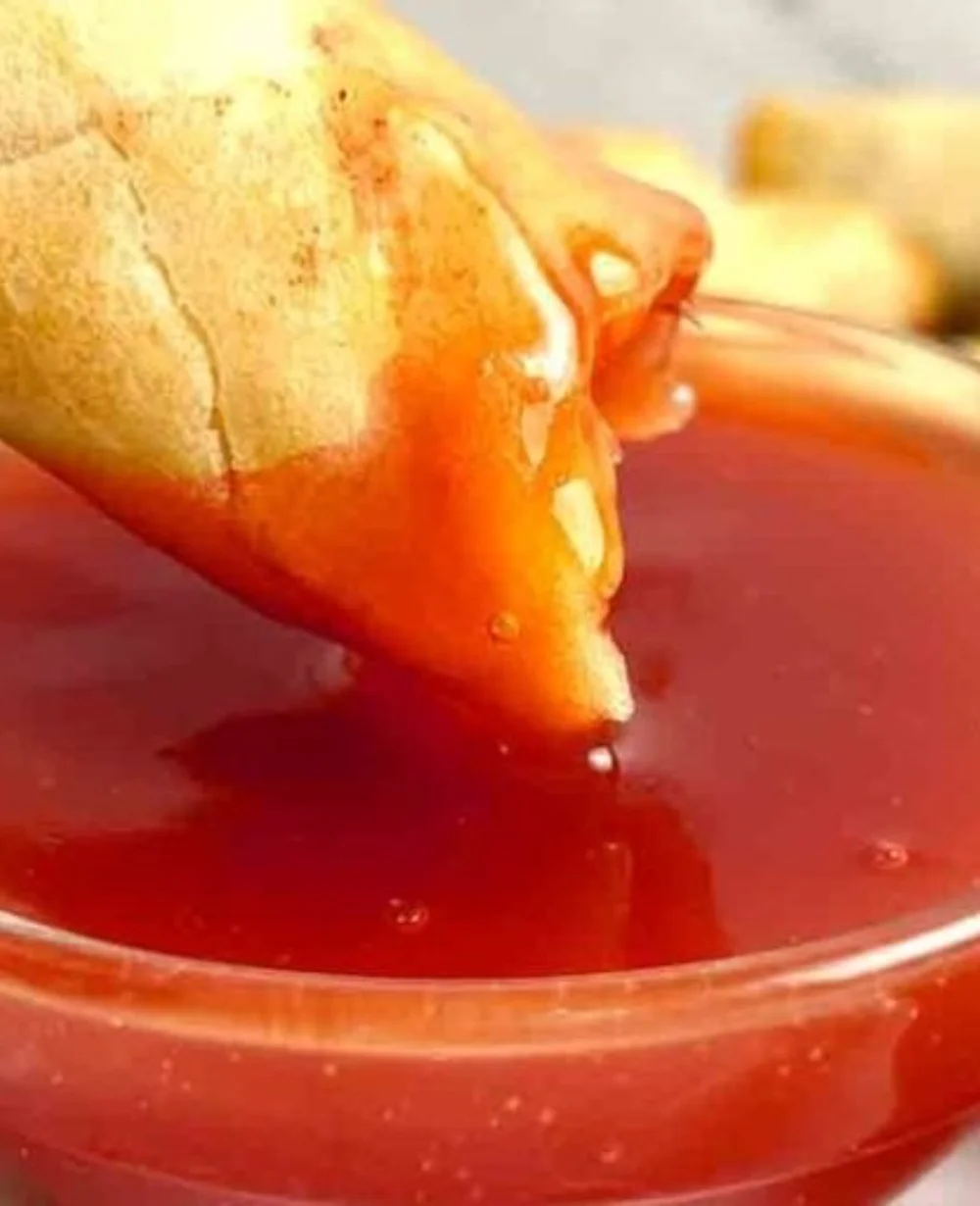 Homemade sweet and sour sauce in a bowl, perfect for stir-fries and dishes.