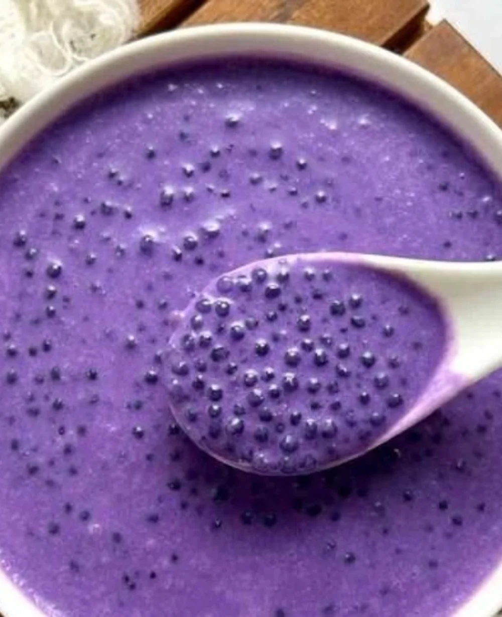 A bowl of ube sago dessert featuring purple yam and sago pearls.