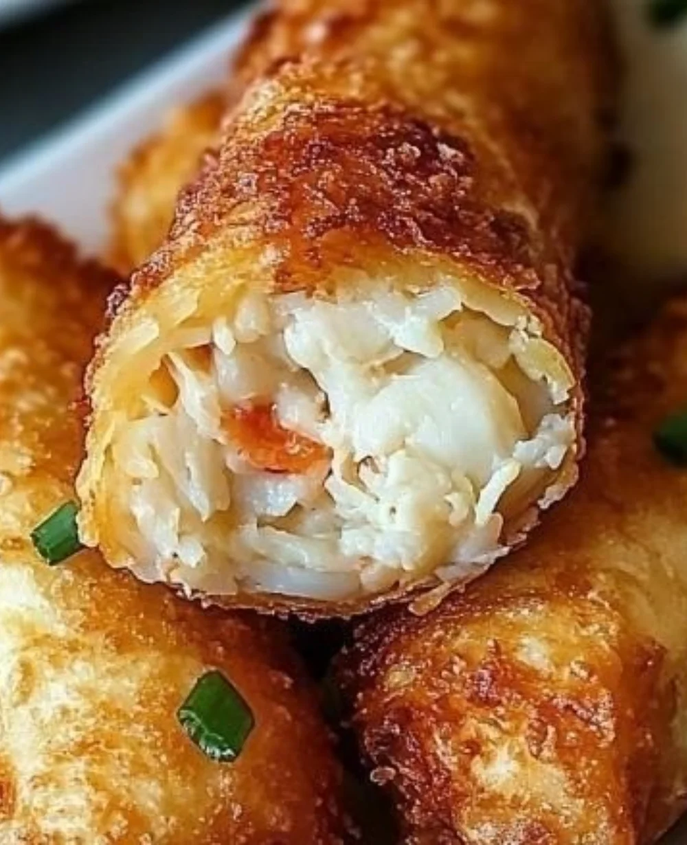 Delicious crab cake egg rolls served with dipping sauce