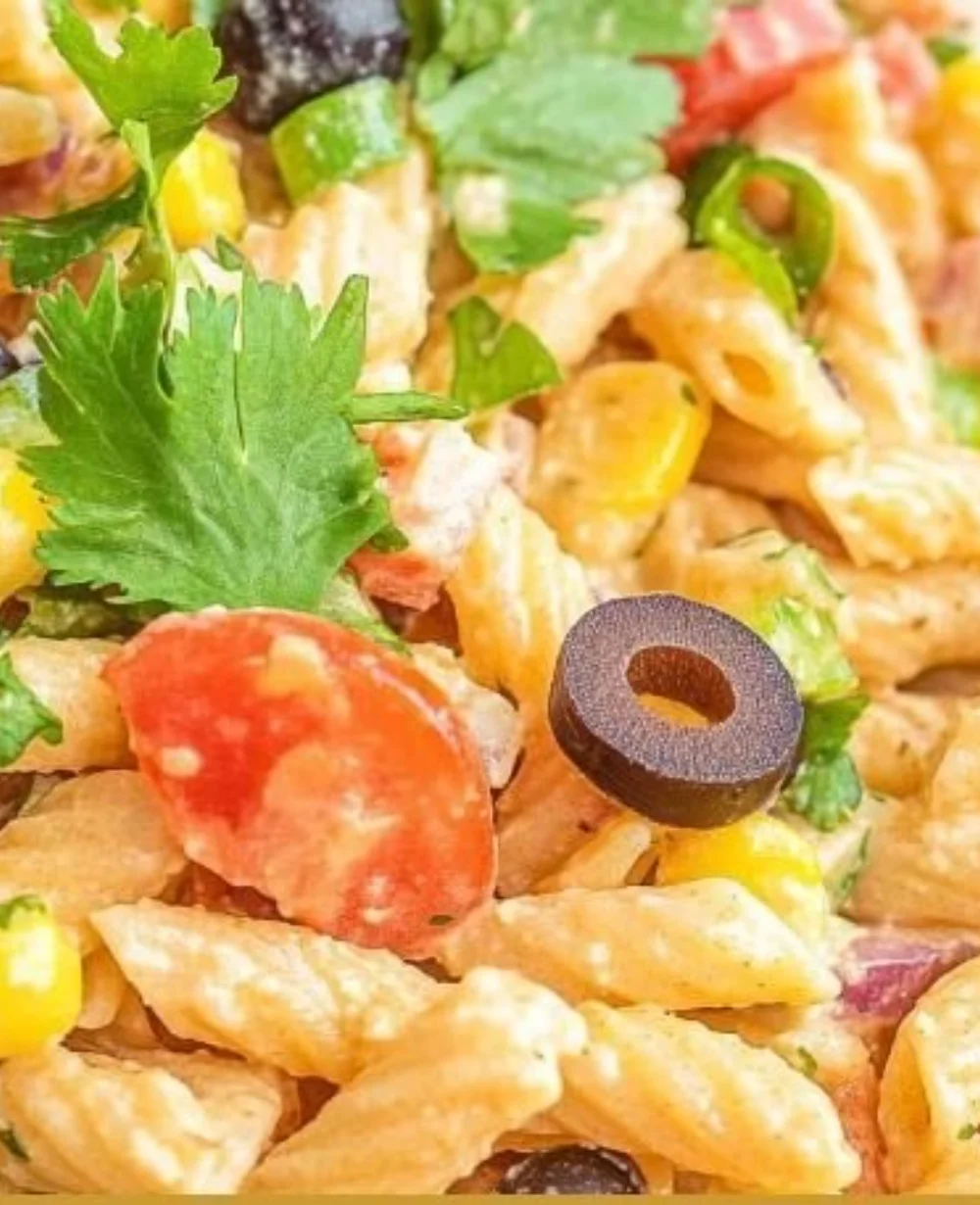 Bowl of Creamy Ranch Taco Pasta Salad with colorful ingredients