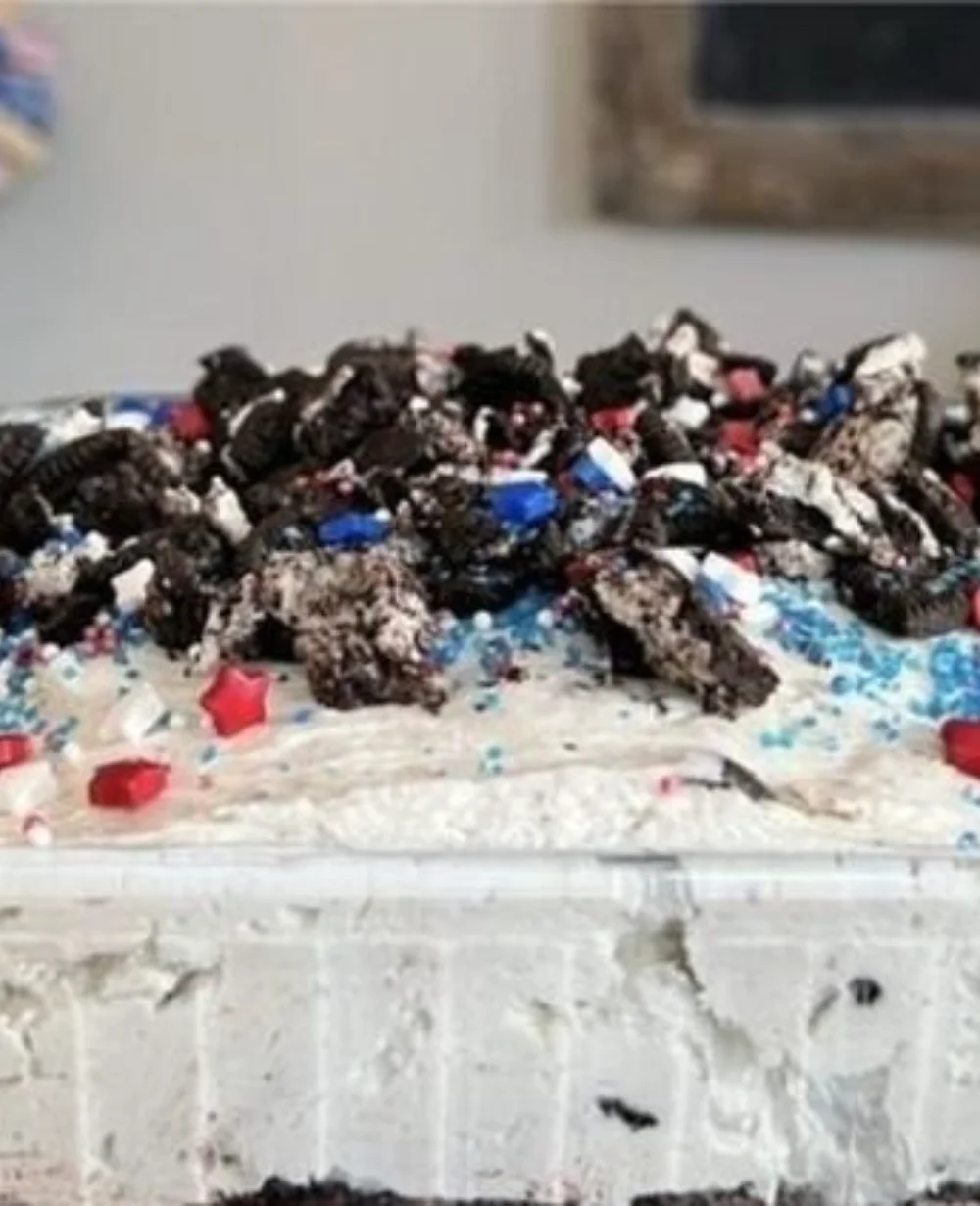 Delicious Fireworks Oreo Cheesecake Bars topped with colorful sprinkles