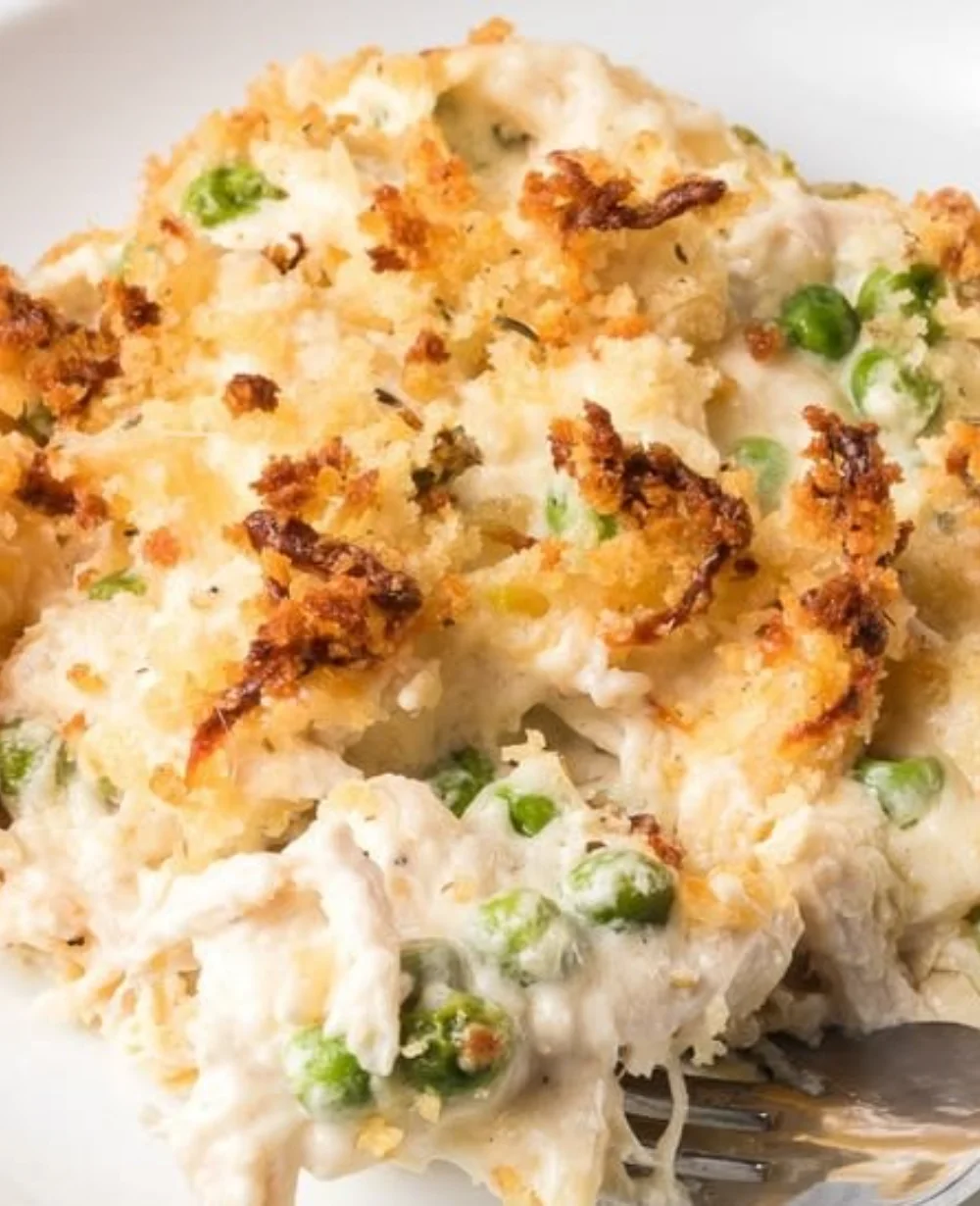 Creamy Chicken Alfredo casserole with pasta and cheese baked to perfection