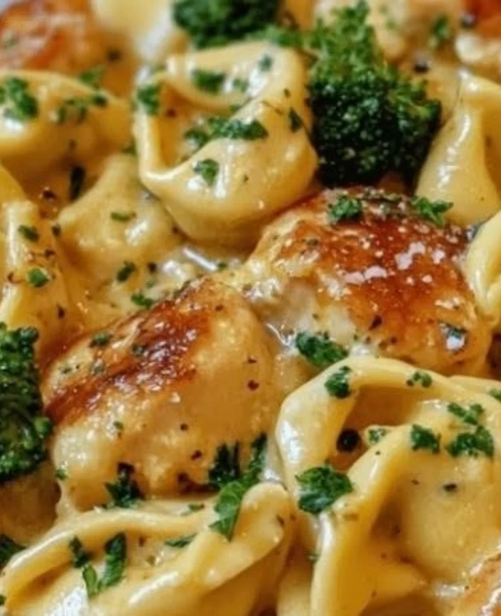 Creamy chicken and broccoli tortellini served in a bowl