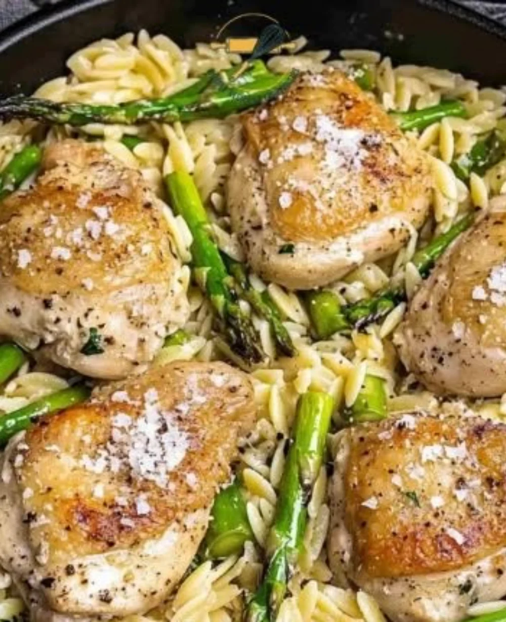 Creamy Parmesan Orzo with chicken and asparagus in a cozy bowl