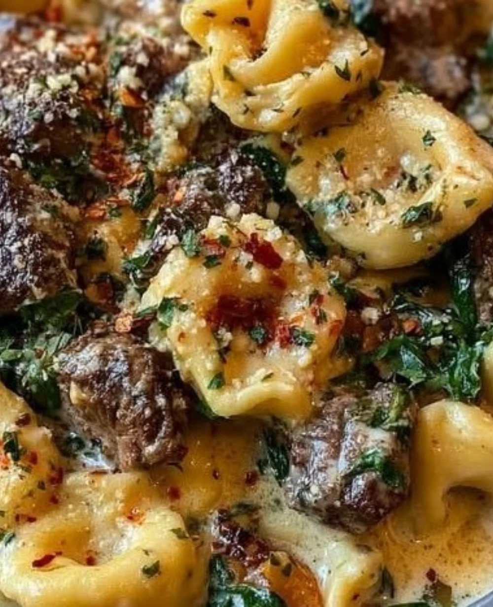 Delicious Garlic Steak Tortellini served in a cozy bowl with fresh herbs.