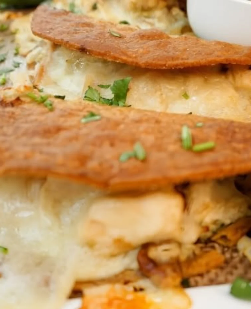 Delicious Green Chile Chicken Tacos topped with fresh ingredients and zesty sauce