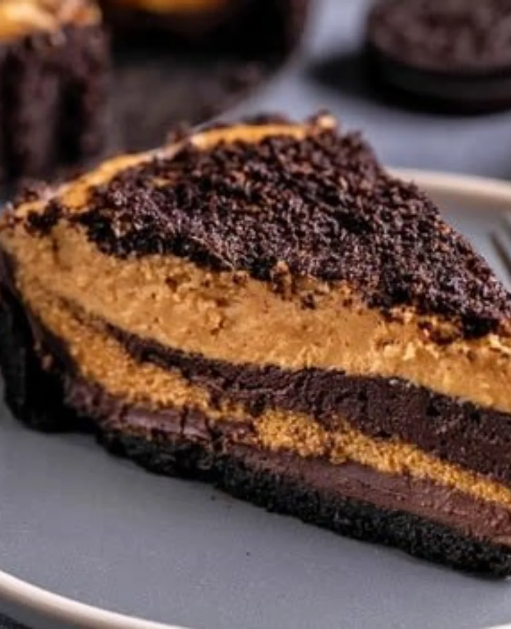 Oreo brownie pie topped with cookie butter and Oreo crumbles