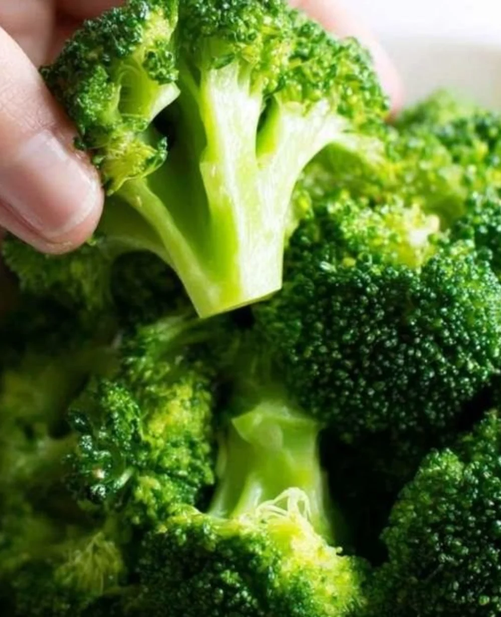 Freshly steamed broccoli on the stove, vibrant green and healthy vegetable