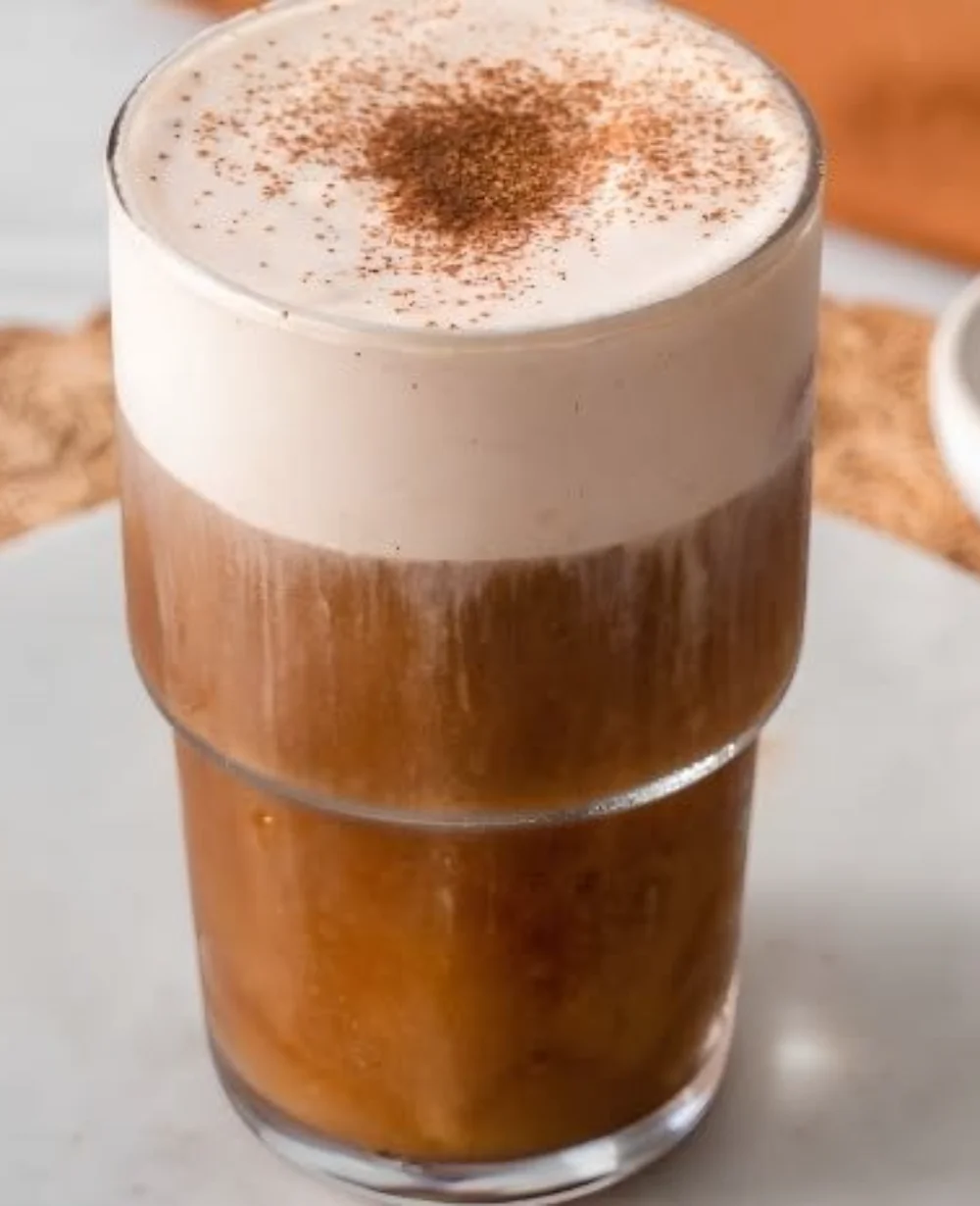 Delicious Pumpkin Cream Cold Brew with pumpkin spice and frothy cream topping