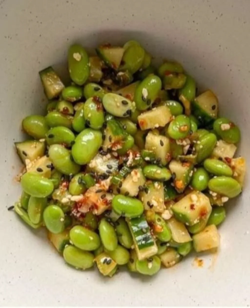 Spicy cucumber edamame salad with vibrant vegetables in a bowl