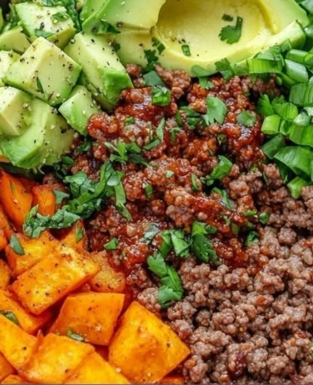 Spicy Ground Beef & Sweet Potato Protein Bowl with vegetables and toppings