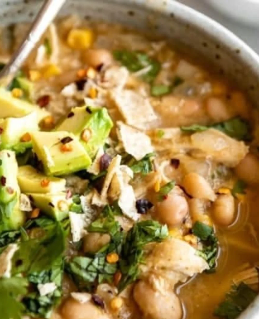 Bowl of white bean chicken chili topped with cilantro and jalapeños